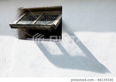 White wall and wooden window frame, stable White wall and wooden window frame, stable 66139380