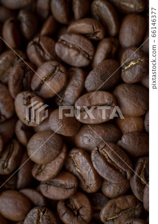 Extremely close-up background roasted coffee beans Extremely close-up background roasted coffee beans 66146377