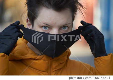 Middle aged european woman in protective black Middle aged european woman in protective black 66146591