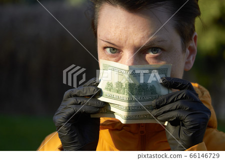 Middle aged european woman in protective black Middle aged european woman in protective black 66146729