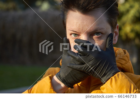 Middle aged european woman in protective black Middle aged european woman in protective black 66146733