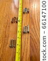 Scews and a tape measure 66147100