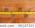 Screws and a tape measure 66147101