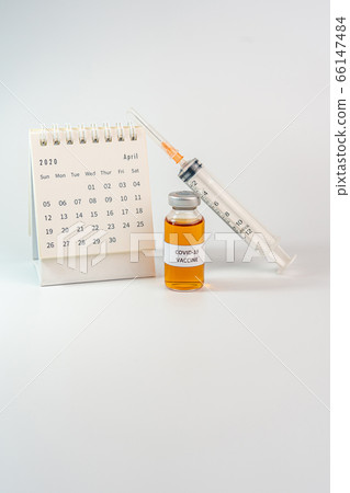 Vertical photo Coronavirus vaccine with Calendar of April 2020 Vertical photo Coronavirus vaccine with Calendar of April 2020 66147484