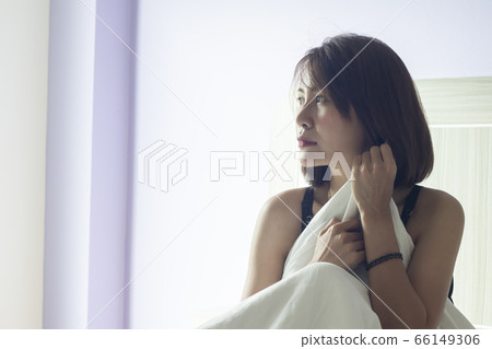 Young Asian woman wake up early morning Young Asian woman wake up early morning 66149306