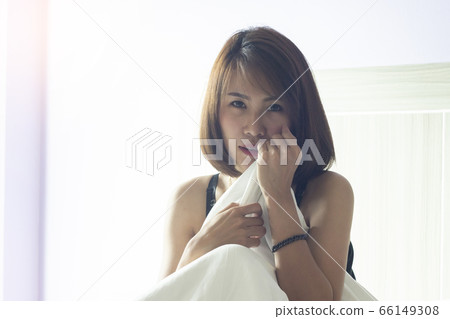 Young Asian woman wake up early morning Young Asian woman wake up early morning 66149308