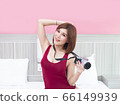 Sexy asian woman posing with camera on her bed 66149939