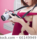 Close up  woman hand  taking a photograph 66149949