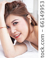 Asian woman Smile face close up and she lying on 66149953
