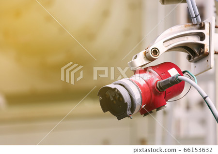Gas detector station on oil and gas plant and monitor gas leaked around the production process for alarm in fire case. with warm light. Gas detector station on oil and gas plant and monitor gas leaked around the production process for alarm in fire case. with warm light. 66153632