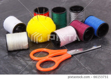 Spools of thread, needle and scissors Spools of thread, needle and scissors 66153731