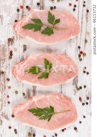 Fresh loin with spices for cooking lunch or dinner Fresh loin with spices for cooking lunch or dinner 66153732