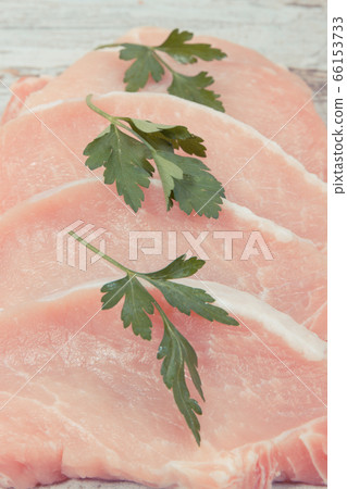 Fresh loin with parsley for cooking lunch Fresh loin with parsley for cooking lunch 66153733