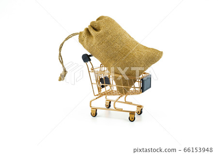 Shopping cart and jute bag isolated on white 66153948