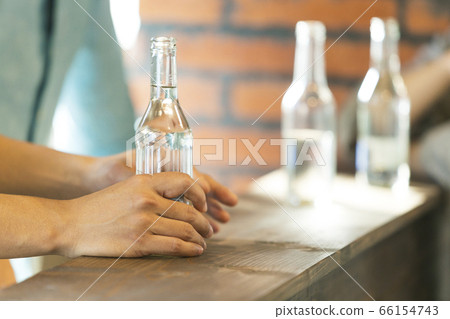 Men and women group chatting at the bar counter Men and women group chatting at the bar counter 66154743