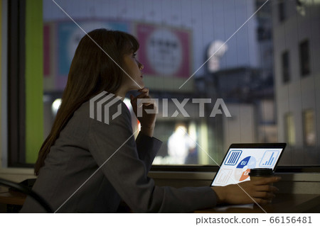Woman working on the windowsill 66156481