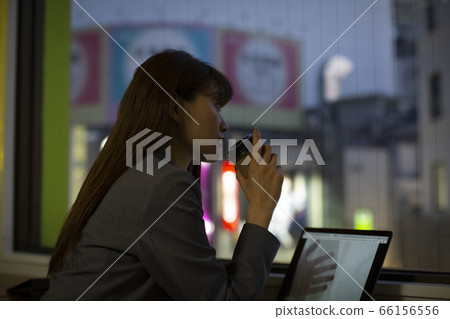 Woman working on the windowsill 66156556