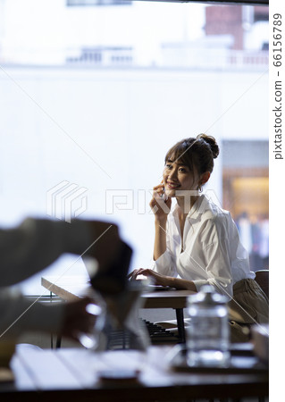 A woman who calls at a cafe 66156789