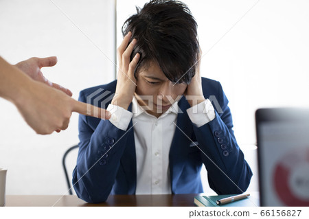 An agonizing businessman 66156827