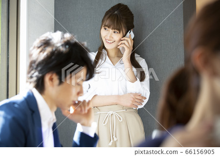 A woman calling inside the company A woman calling inside the company 66156905