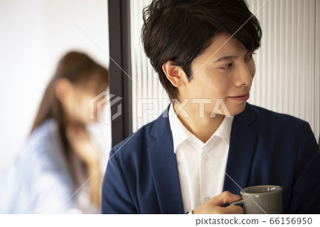 Men with mugs in the office 66156950