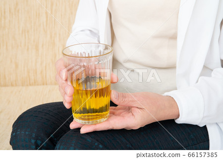 Senior woman drinking tea 66157385