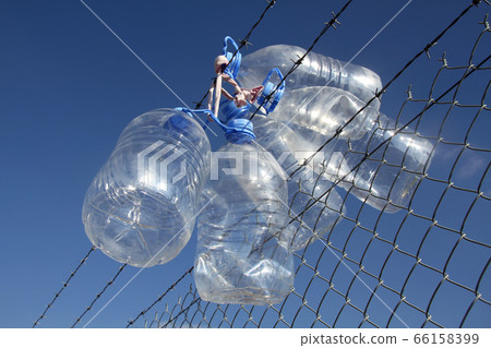 Empty wet plastic water bottles  66158399