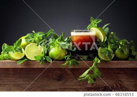 Carbonated drink with limes and mint on a old Carbonated drink with limes and mint on a old 66158553