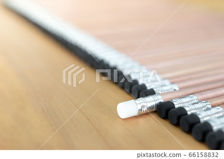 Wooden pencils with black eraser place on Wood background And Close Up, One pencil singled out Wooden pencils with black eraser place on Wood background And Close Up, One pencil singled out 66158832