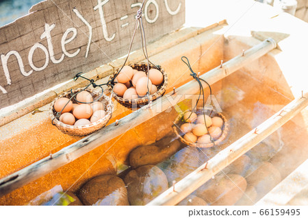 Hot natural underground thermal water is used to boil chicken eggs in some volcanic activity area. Hot natural underground thermal water is used to boil chicken eggs in some volcanic activity area. 66159495
