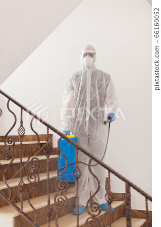 Disinfectant working in protective suit 66160052