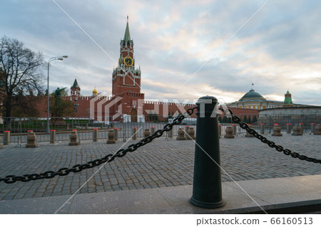 Back lit photography of Moscow Red Square. Spasskaya Tower, Red Kremlin wall, Residence of the President of the Russian Federation. Coronavirus pandemic. No tourists. Back lit photography of Moscow Red Square. Spasskaya Tower, Red Kremlin wall, Residence of the President of the Russian Federation. Coronavirus pandemic. No tourists. 66160513