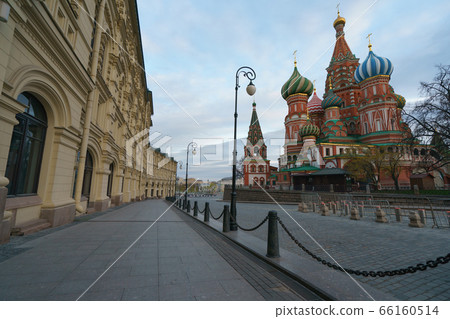 Photography of the domes of the Saint Basil's Cathedral / Cathedral of Vasily the Blessed and facades of GUM (Central Department Store). Moscow Red Square.Coronavirus pandemic time. No people. Photography of the domes of the Saint Basil's Cathedral / Cathedral of Vasily the Blessed and facades of GUM (Central Department Store). Moscow Red Square.Coronavirus pandemic time. No people. 66160514
