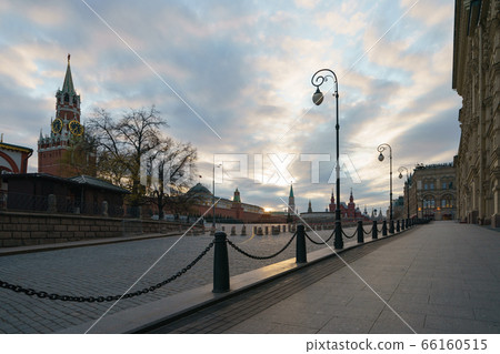 Back lit photography of Moscow Red Square. Spasskaya Tower, Red Kremlin wall, Residence of the President of the Russian Federation. Coronavirus pandemic. No tourists. 66160515