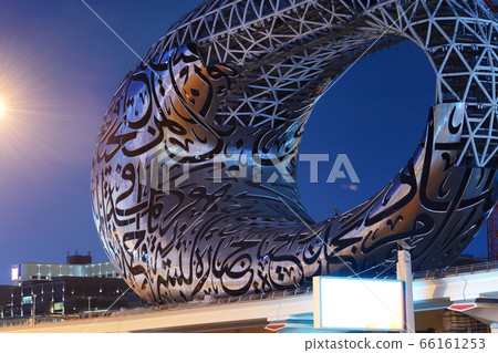The construction of Museum of the Future in night illumination, Dubai, UAE 66161253