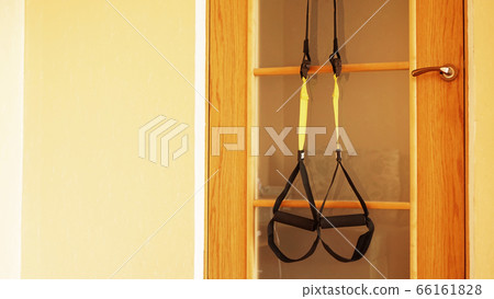 Closeup view of suspension on door training at home Closeup view of suspension on door training at home 66161828