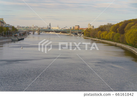 Moskva River embankment, Gorky Park is popular for walking. Coronavirus pandemic. Rest for nature. Peter the Great Statue, Kremlin, Andreevsky (Pushkinsky) pedestrian bridge in distance Moskva River embankment, Gorky Park is popular for walking. Coronavirus pandemic. Rest for nature. Peter the Great Statue, Kremlin, Andreevsky (Pushkinsky) pedestrian bridge in distance 66161842