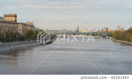 Moskva River embankment, Gorky Park is popular for walking. Coronavirus pandemic. Rest for nature. Peter the Great Statue, Kremlin, Andreevsky (Pushkinsky) pedestrian bridge in distance Moskva River embankment, Gorky Park is popular for walking. Coronavirus pandemic. Rest for nature. Peter the Great Statue, Kremlin, Andreevsky (Pushkinsky) pedestrian bridge in distance 66161843