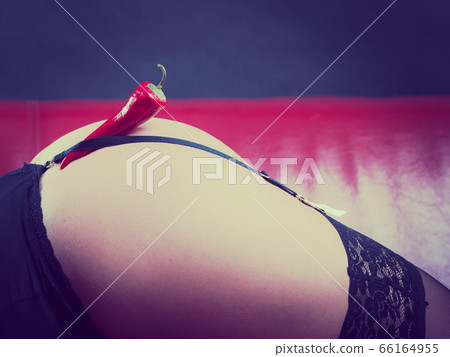 Woman wearing sexy panties having pepper on 66164955
