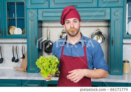 Professional kitchen. Traditional cuisine. Man at 66171774