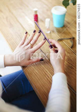 Woman making manicure at home Woman making manicure at home 66174835