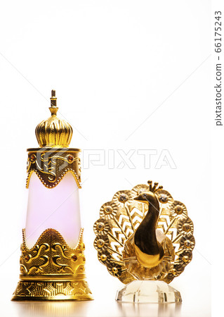 glass perfume bottle gold peacock white background glass perfume bottle gold peacock white background 66175243