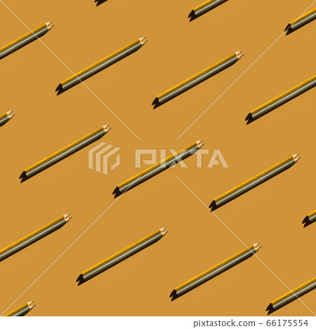 Pattern of gold and silver pencils on gold background. Pattern of gold and silver pencils on gold background. 66175554