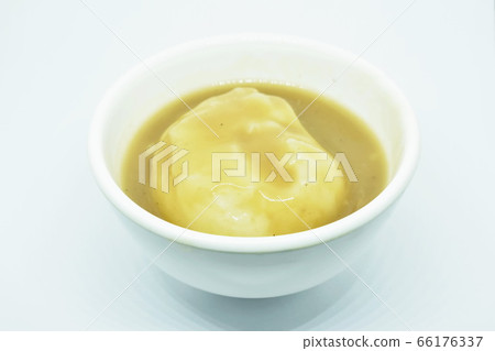 mashed potato dressing gravy sauce in cup on white background 66176337