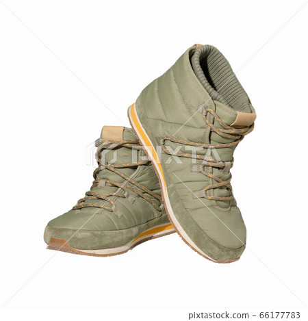 Warm puffy boots or lace-up ankle boots. Winter and demi-season shoes. Isolated on white background 66177783