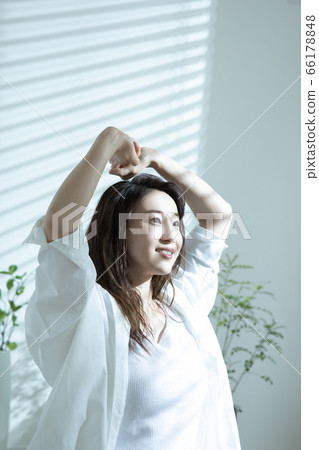Woman waking up in the morning 66178848