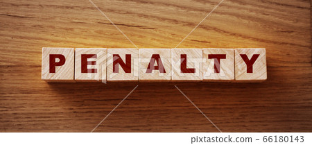 Penalty word from wooden blocks on desk 66180143