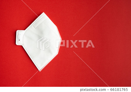 Respirator mask FFP or dust mask to cover the mouth and nose prevent coronavirus isolated on red background. Breathing protection against air pollution, flu and coronavirus. 66181765