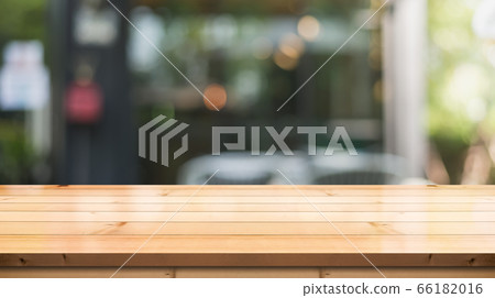 Empty wooden table top on abstract blur background Empty wooden table top on abstract blur background 66182016