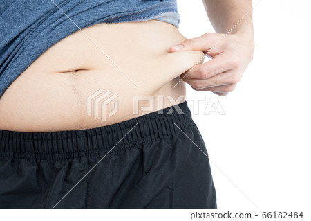 Fat man holding excessive fat belly, overweight 66182484
